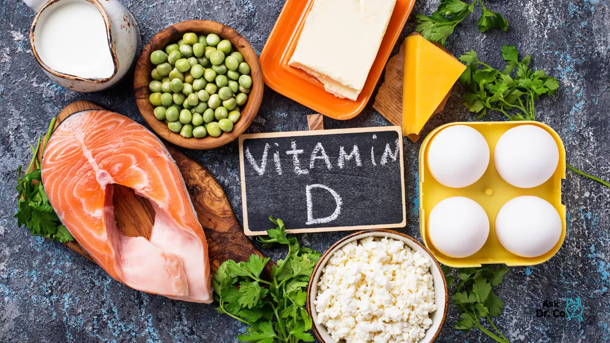 Vitamin D rich foods including salmon, eggs, dairy, and green vegetables arranged on a table